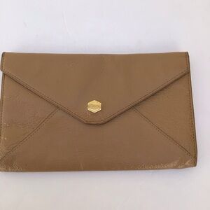 Lodi’s tan patent leather envelope bag